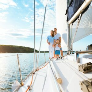 Family Vacation On Yacht, Parents And Daughter Sailing Across Sea