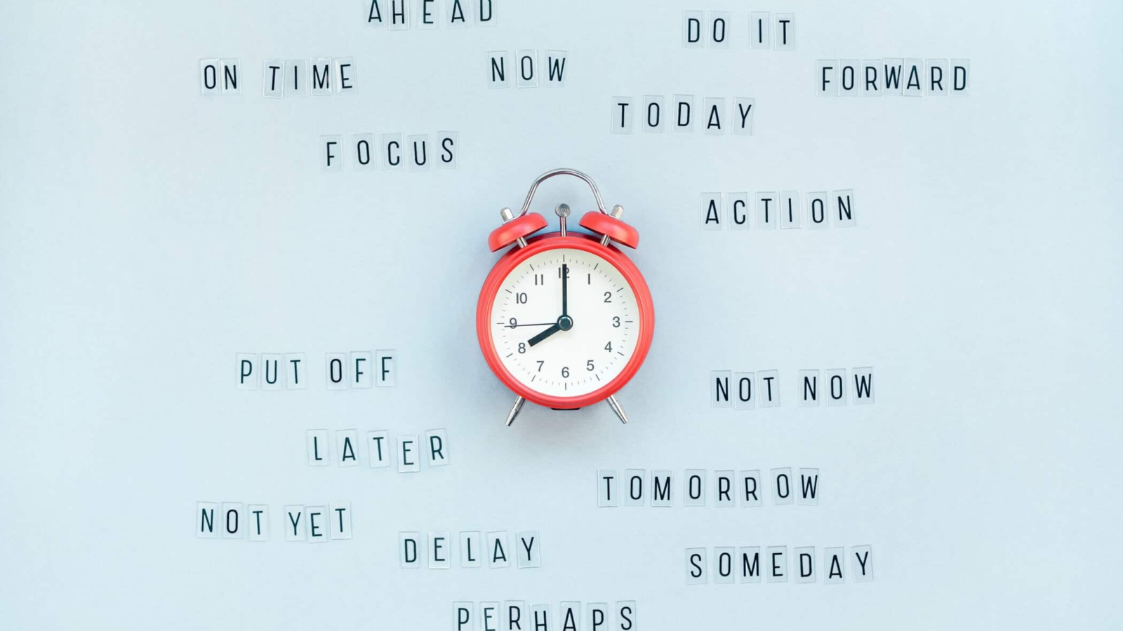 Creative top view flat lay of alarm clock with messages about delay or starting doing task copy space blue background minimal style. Concept of procrastination, time management in business and life