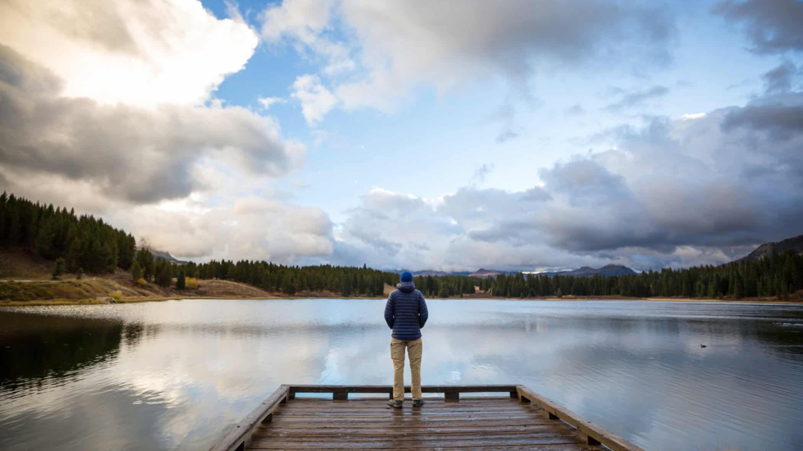 Man on mountains lake